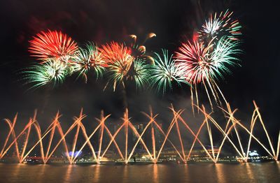 Blazing fireworks and pyrotechnics display lighting up the nigh sky