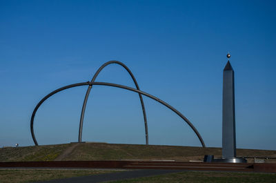 Low angle view of landmark against clear blue sky