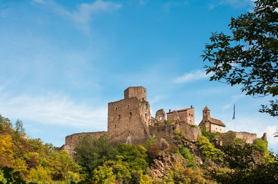 Low angle view of fort against blue sky