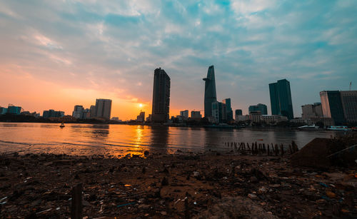 Buildings in city at sunset