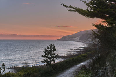 Scenic view of sea against sky during sunset