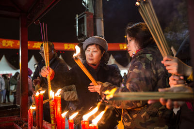 Group of people at illuminated temple