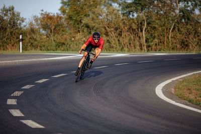 Man riding bicycle on road