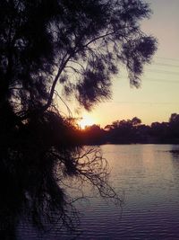 Scenic view of lake at sunset