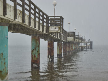Pier over sea against sky