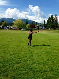 People walking on grassy field