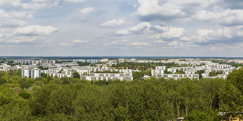 High angle view of trees and buildings against sky