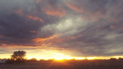 Low angle view of dramatic sky during sunset