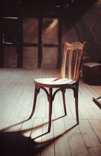 Close-up of empty chair on table