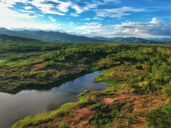 Scenic view of lake and mountains against sky