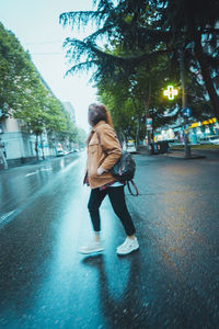 Full length of woman on street in city