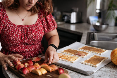 Midsection of woman holding food