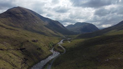 Driving through a secluded road in the scottish highlands near glencoe, uk