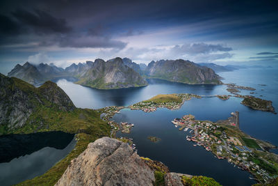 Scenic view of lake and mountains against sky