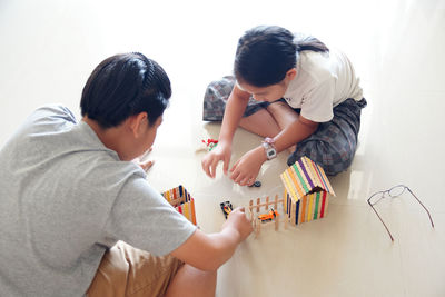 Father and son playing with toy
