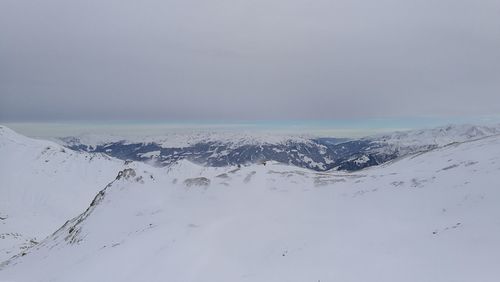 Scenic view of snow covered mountain against sky