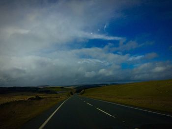 Road passing through field