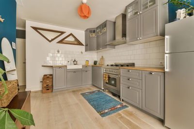 Low angle view of man standing in kitchen