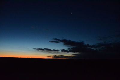 Scenic view of silhouette landscape against sky at sunset