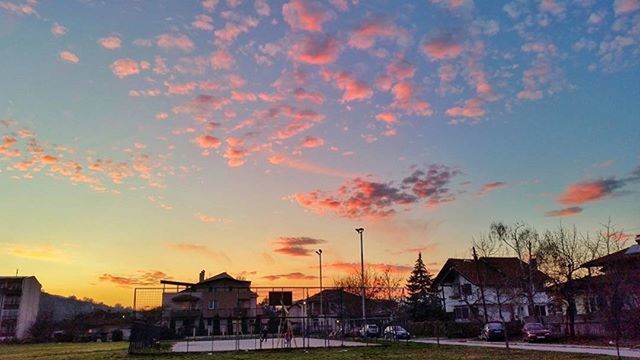 building exterior, sunset, architecture, built structure, sky, house, cloud - sky, orange color, car, city, residential structure, transportation, residential building, cloud, land vehicle, street, building, outdoors, road, silhouette