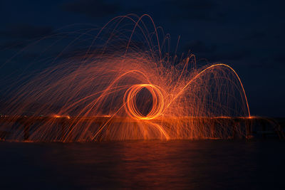 Light painting against sky at night