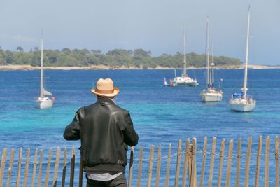 Rear view of man on shore