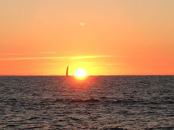 Scenic view of sea at sunset