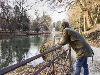 Man on the lakeside of the lake of villa reale in monza