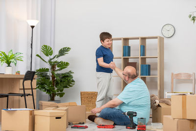 Side view of young woman working at home