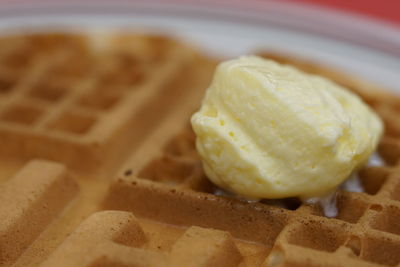 Close-up of butter melting on waffle