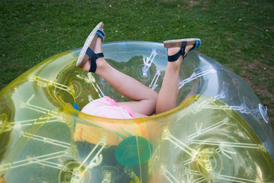 High angle view of woman lying down in swimming pool