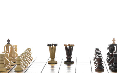 Close-up of chess board against white background