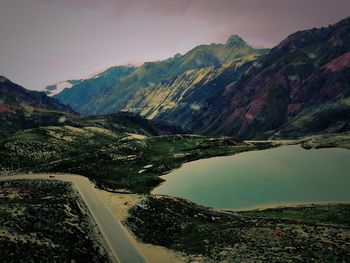 Scenic view of lake and mountains against sky