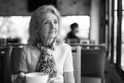 Portrait of woman with coffee