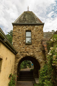 Low angle view of old building against sky