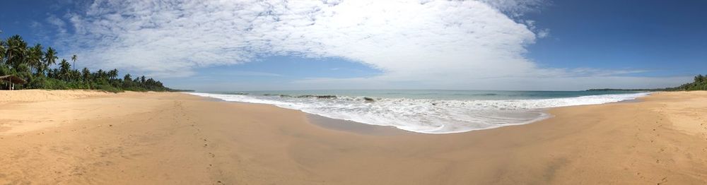 Panoramic view of beach against sky