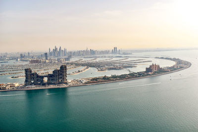 City at waterfront against sky