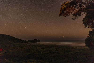 Scenic view of sea against sky at night