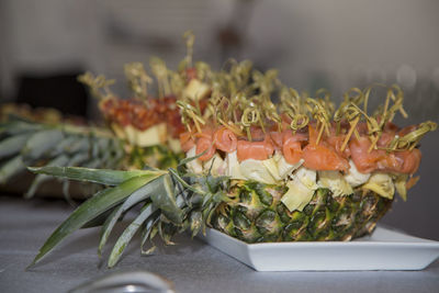 Close-up of food in pineapple on table