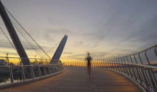 Elizabeth quay bridge against sky during sunset