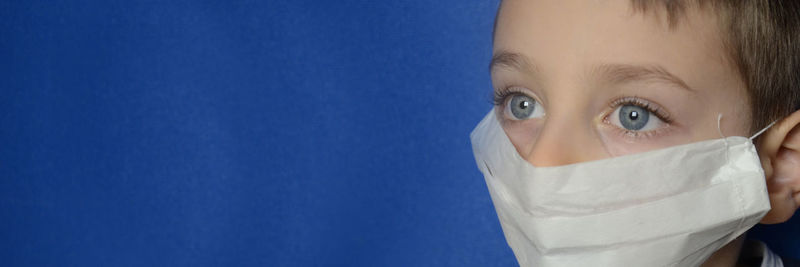 Portrait of young woman covered with blue eyes