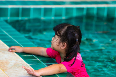 High angle view of woman swimming in pool