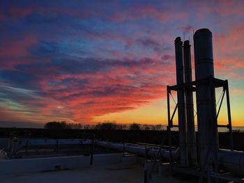 Factory against sky during winter