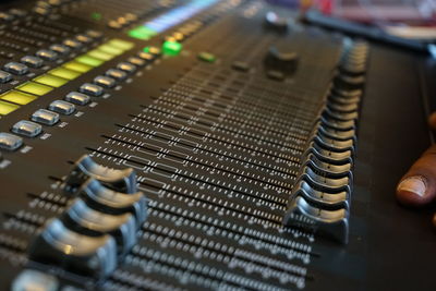 Close-up of sound mixer in recording studio