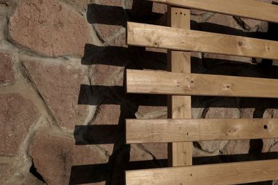 High angle view of pallet on stone wall