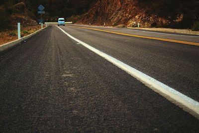 Distant view of vehicle moving on road