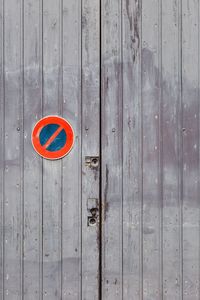 No parking sign on wooden wall