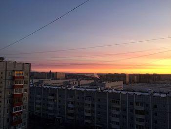 High angle view of buildings against sky during sunset