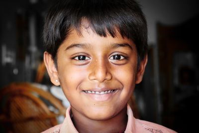 Close-up portrait of smiling boy