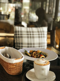 Close-up of coffee cup on table in restaurant